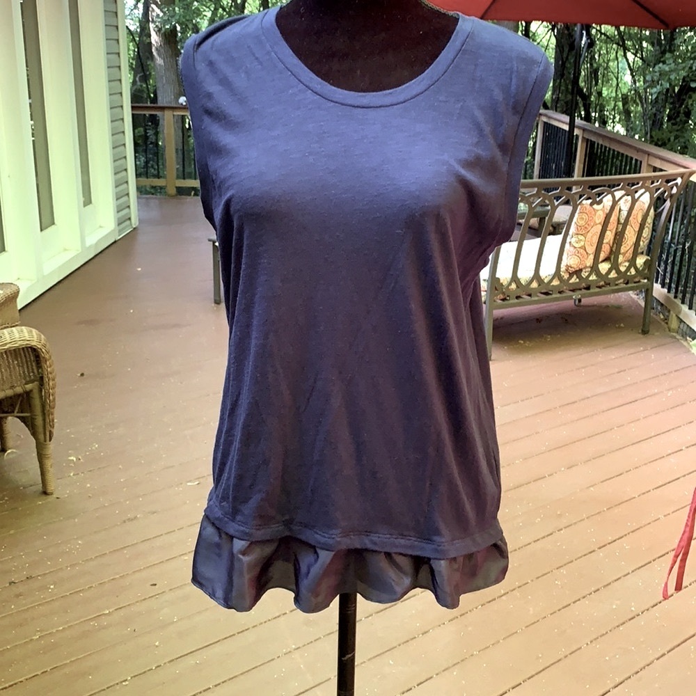 J Crew navy sleeveless peplum T-shirt.